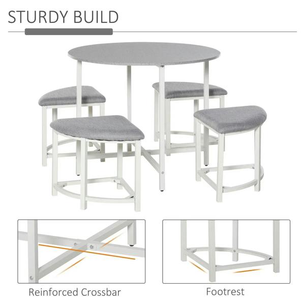 Grey round dining table with four grey upholstered stools and sturdy white frame