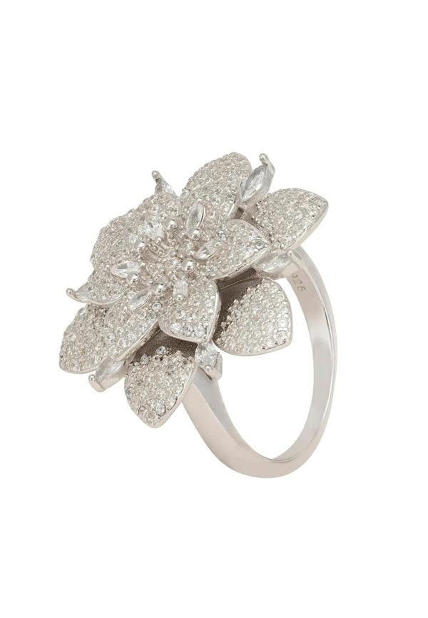 Silver floral ring with gemstones on a white background
