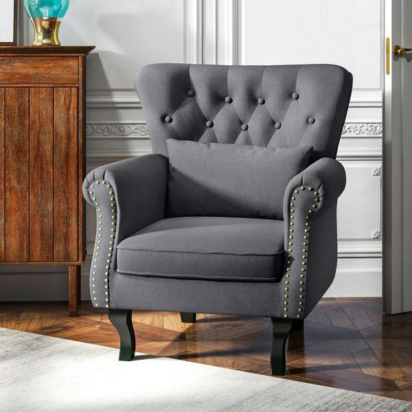 Dark grey Chesterfield-style accent chair with tufted back and nailhead-trim wingback arms