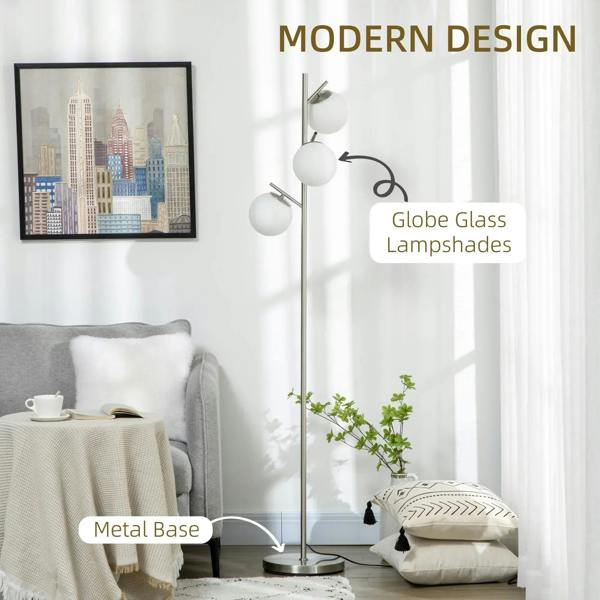 Silver floor lamp with three white globe glass shades and metal base