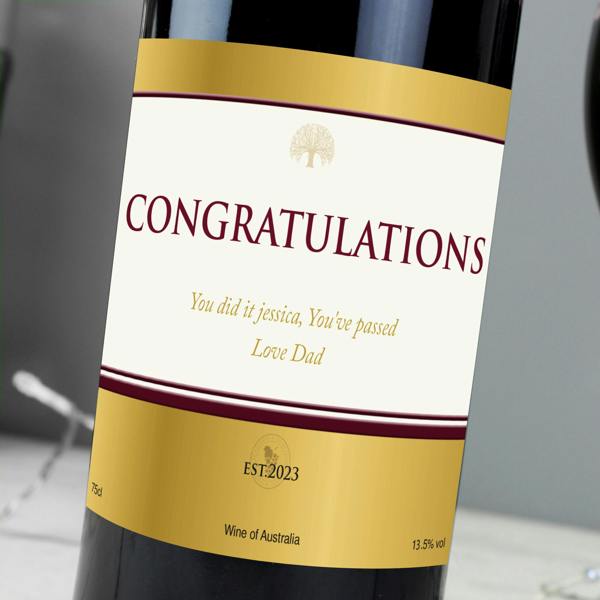 Close-up view of a custom printed gold label on a bottle of Personalised Red Wine reading CONGRATULATIONS.
