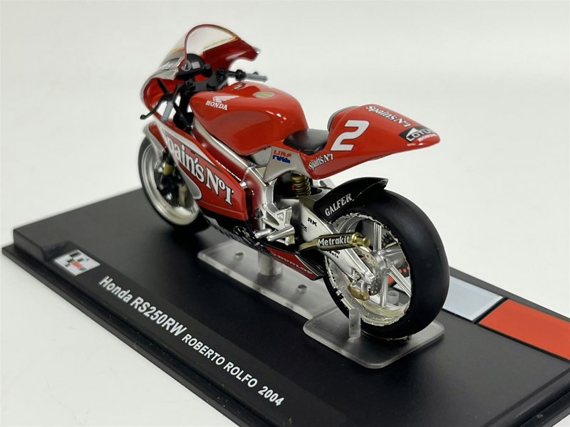 a red motorcycle on a stand