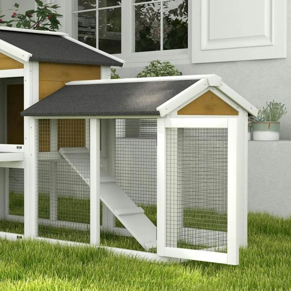 Yellow double-tier rabbit hutch with ramp, wire mesh walls and dark roof for outdoors