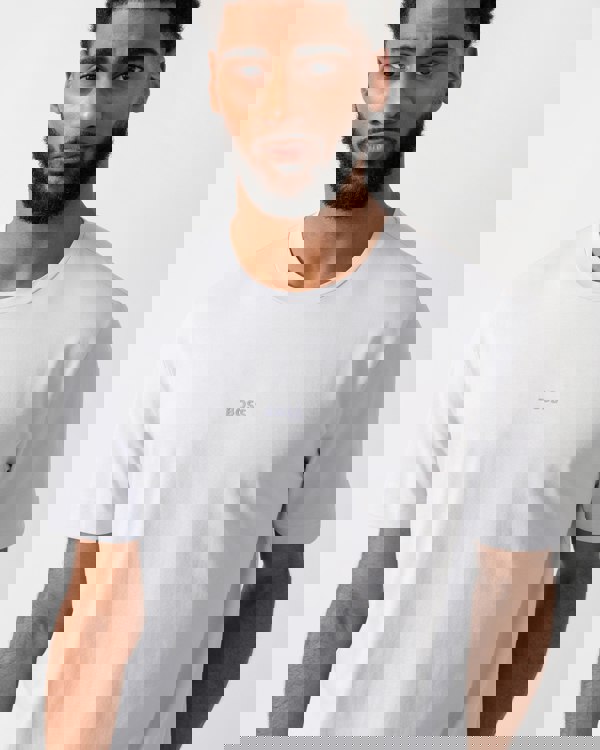 detail shot of a model wearing a BOSS Orange TChup Mens Crew Neck Small Logo T-Shirt in Light-Pastel Grey