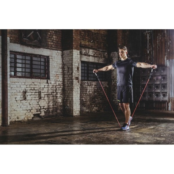 Man doing resistance training using Reebok Power Tube Set