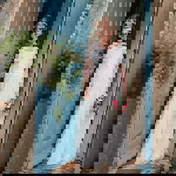 Floor Girl wearing a Flutter Dress in Ivory