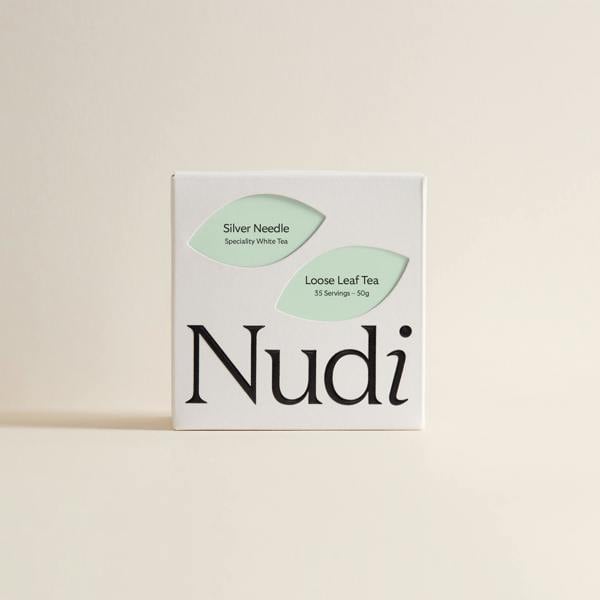 Nuditea silver needle luxury tea box with a green and mint design.