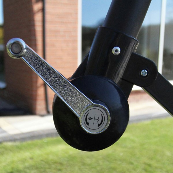 Close-up of the black parasol's crank mechanism, showcasing its sleek design and textured handle for easy opening and closing