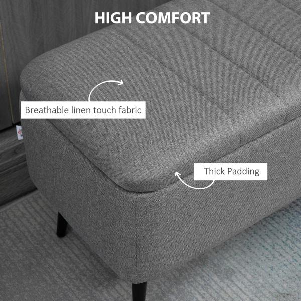 Grey linen-look storage ottoman bench with thick padded seat and steel legs
