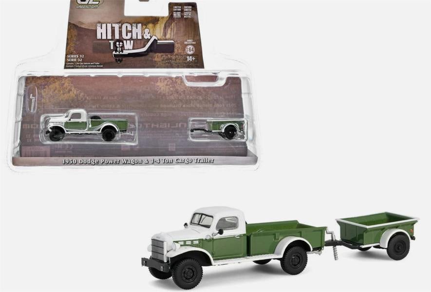 a green and white toy truck with a trailer
