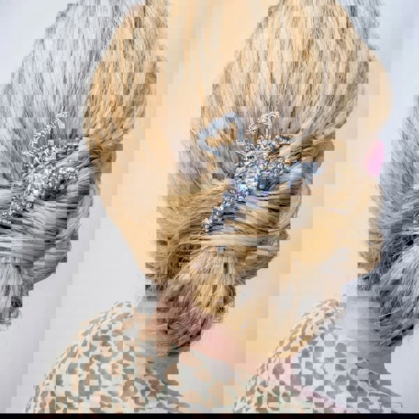 silver claw hair clip worn with bun updo