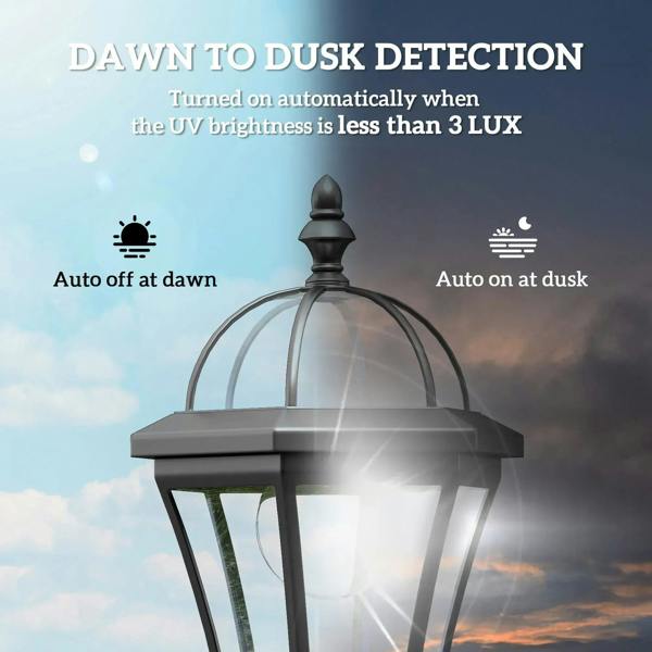 Black solar lantern post light with bright LED glow behind clear glass panels.