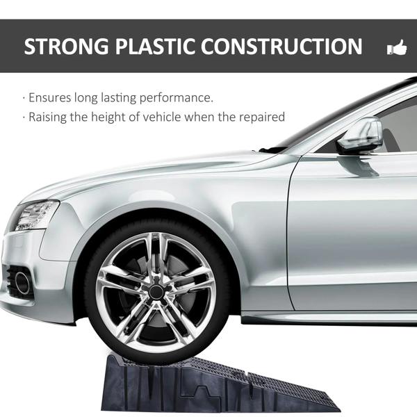 Car front wheel resting on a black plastic car ramp with textured anti-slip grooves