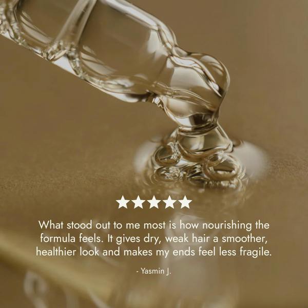 Rosemary Hair Oil Co. bottle on a stone platform with a neutral background. Rosemary hair oil, castor oil, camellia oil, apricot oil, hair growth, healthier, fuller-looking hair, stimulate, regrowth, hair thinning, natural, 100ml, review, 5 star