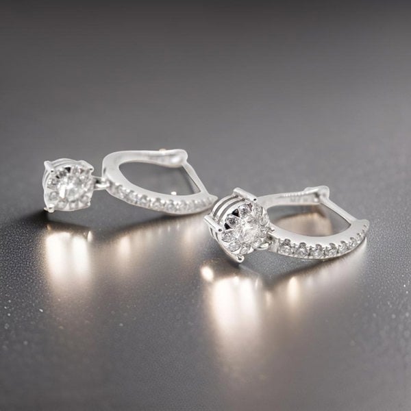 A pair of diamond hoop and drop earrings