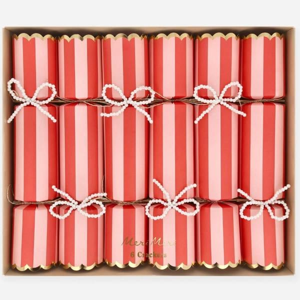 Set of six red and pink striped Christmas crackers with faux pearl bow decorations in a presentation box.