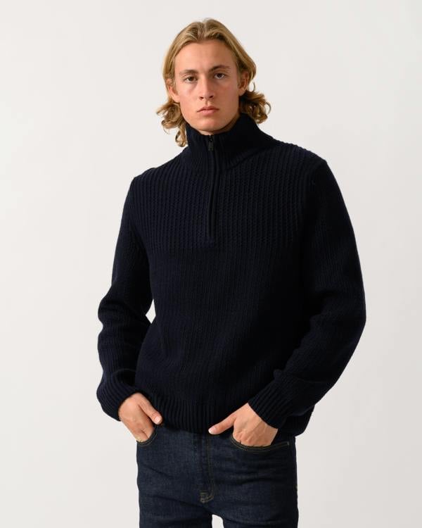 model wearing a BOSS Orange Kenter Mens 1/4 Zip Funnel Neck Jumper in Dark Blue 404