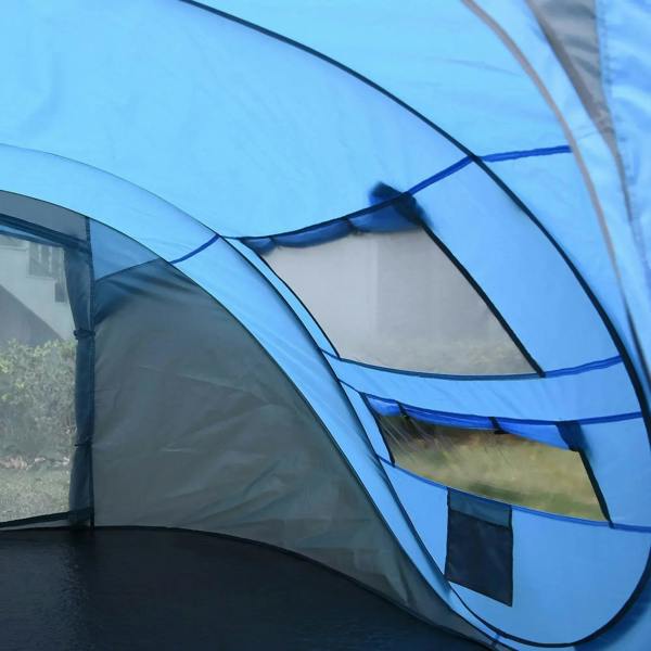 Close-up of sky blue pop-up tent showing curved fabric, mesh window sections, and ties