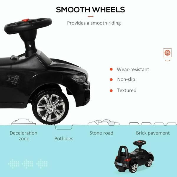 Black ride-on car with chrome-look wheels and side body details for smooth riding