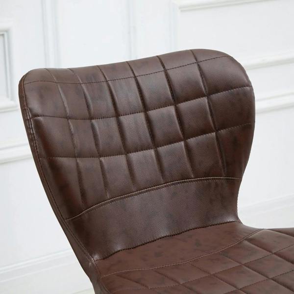 Close-up of brown tufted PU leather bar stool backrest and seat with stitched grid