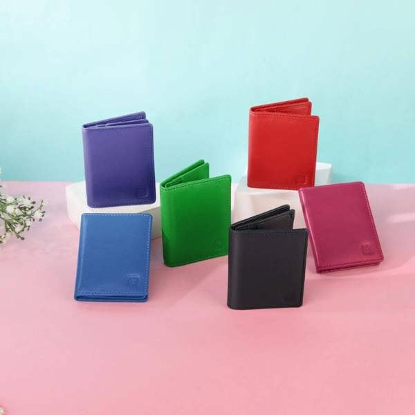 Set of colorful wallets on a pink and blue gradient background