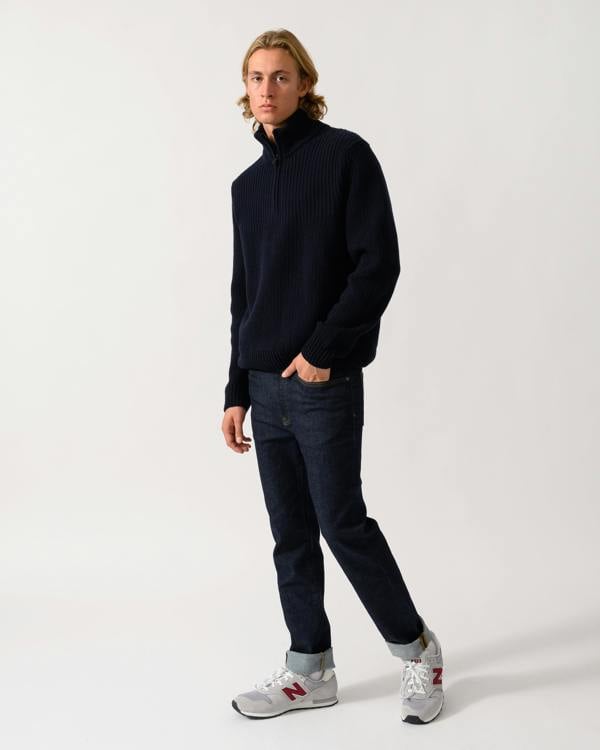 full length of a model wearing a BOSS Orange Kenter Mens 1/4 Zip Funnel Neck Jumper in Dark Blue 404