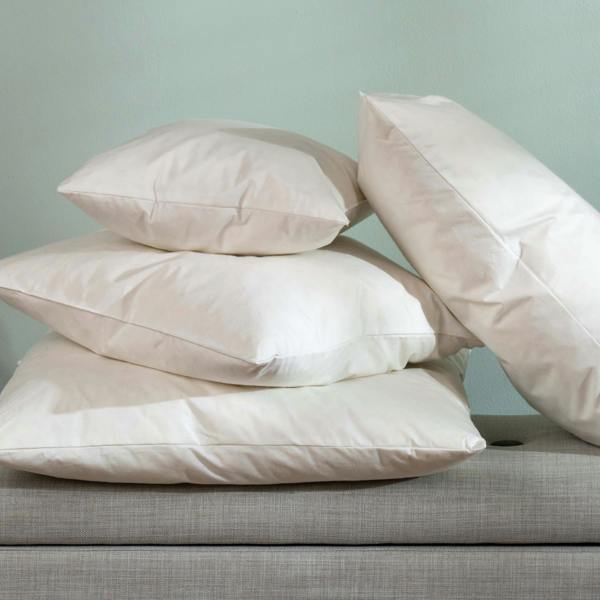 Duck Feather Cushion Pads styled in a bedroom | Soak and Sleep