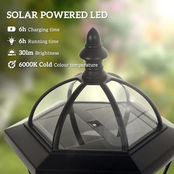 Close-up of a black solar lantern with arched clear glass panels and top cap.