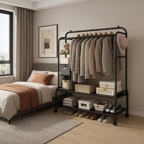 Black heavy-duty metal clothes rail with wheels and double hanging bars for garment storage

