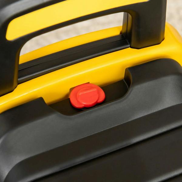 Close-up of CAT ride-on excavator gray foot pedal with red horn button