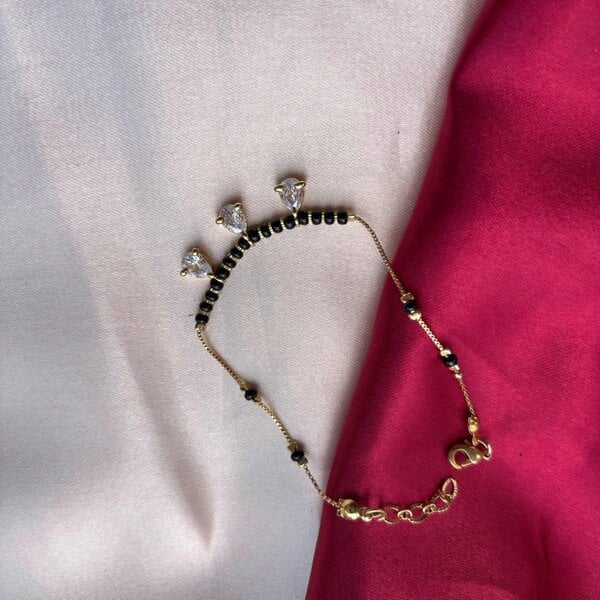 The Colourful Aura Black Bead Mangalsutra Zircon drop gold nazar Bracelet