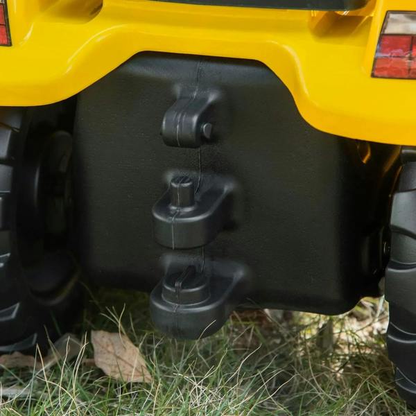 Close-up of black controls area on the yellow kids ride-on tractor go-kart