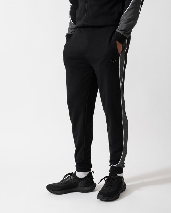 Model wearing a BOSS Orange Mens Loungewear Tracksuit Pants in Black