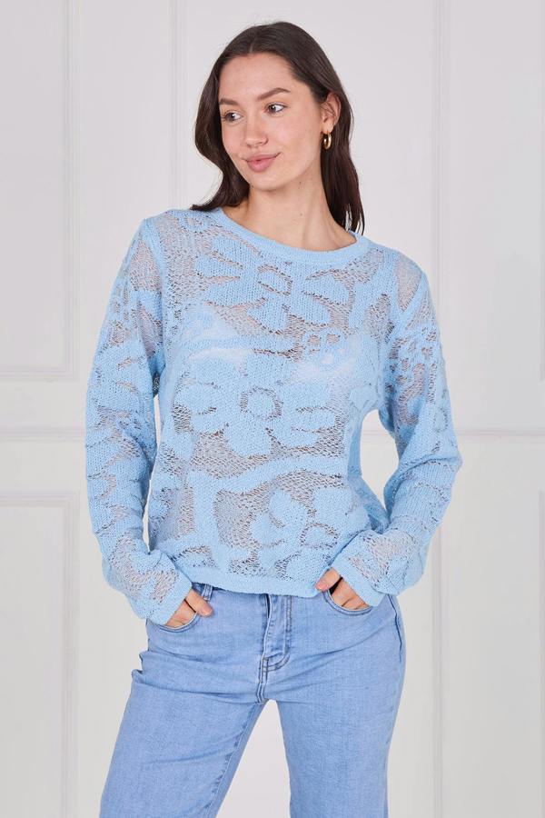 Model wearing a long sleeve crochet top with an open-knit pattern, styled with high-waisted jeans, featuring a relaxed fit and lightweight texture for casual everyday wear.
