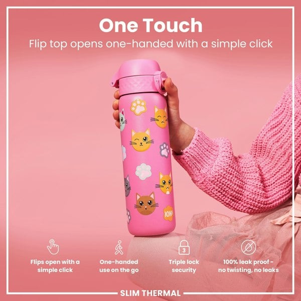 A pink water bottle, decorated with cats, is being held. Its flip top opens one-handed. The bottle is advertised as leakproof and has triple-lock security.