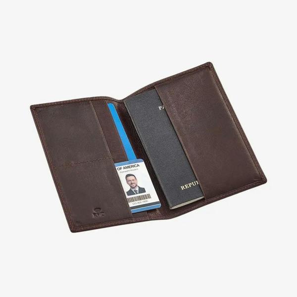 Brown leather passport holder with card slots and a passport holder on a white background