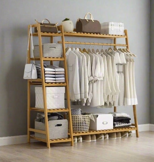 Freestanding bamboo clothes storage rack with hanging rail and shelves

