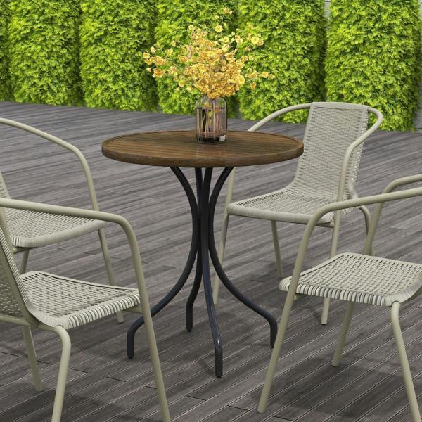 Brown round slatted garden table with black pedestal base in outdoor patio setting.