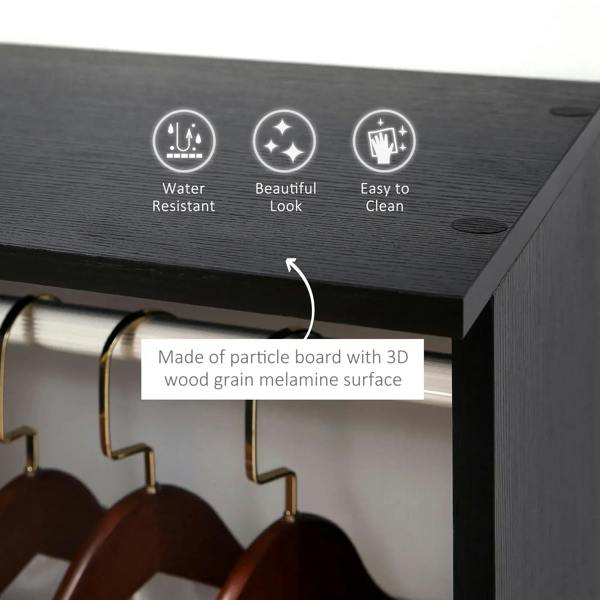 Black wardrobe cabinet top with wood-grain finish and visible corner edge detail
