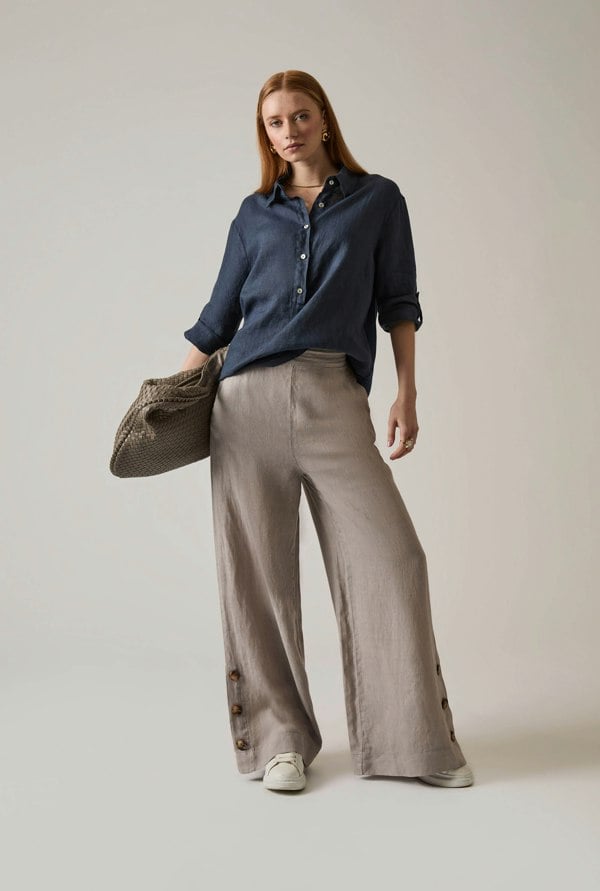 Navy linen blouse with button front and roll tabs