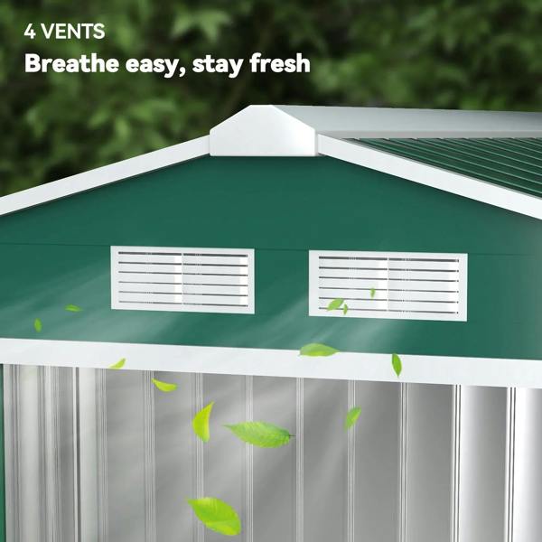 Green metal shed with four ventilation vents under the roof ridge