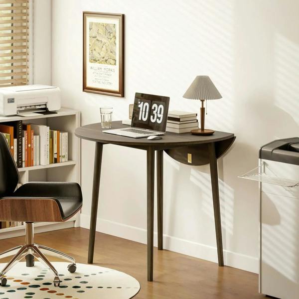 Grey round drop-leaf folding dining table with wood legs, compact one-leaf setup