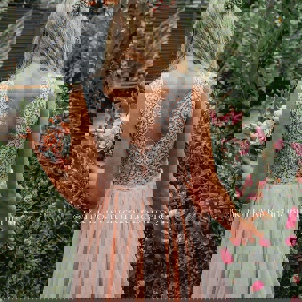 Young girl in blush pink dress