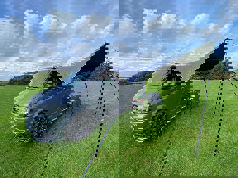 Image of Modern Shade Canopy grey with  Lime by OLPRO fitted on T5 Campervan, picture from left side showing the height and space available.