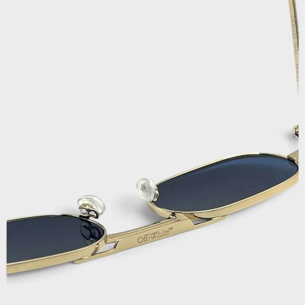 Supplied Fashion Baltimore Arrow sunglasses featuring a silver frame, dark lenses, and Off-White branding detail.