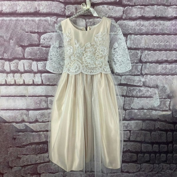 Harlow dress in Champagne colour on a hanger