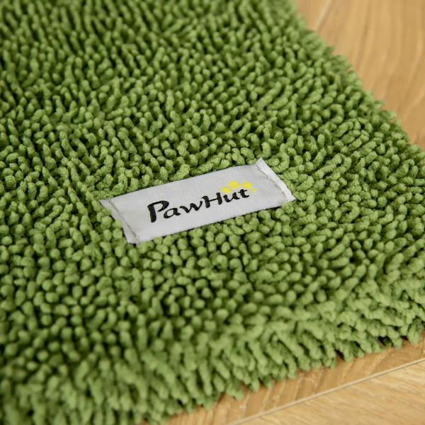 Close-up of green sisal scratching surface with fabric label on cat tree