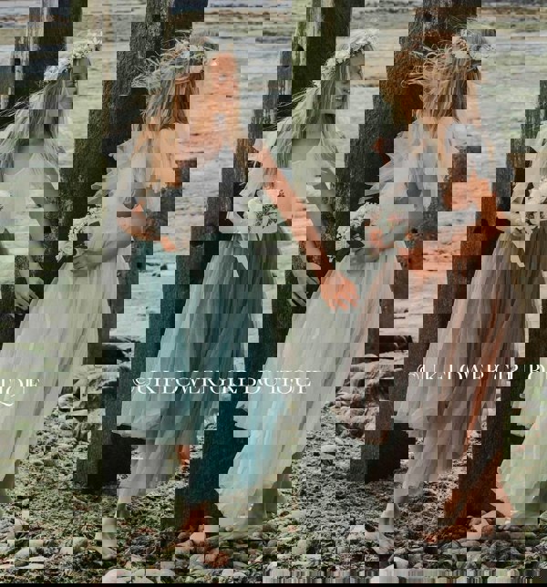 Young girl in blush pink dress