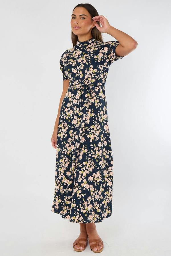 Woman wearing a floral dress on a white background