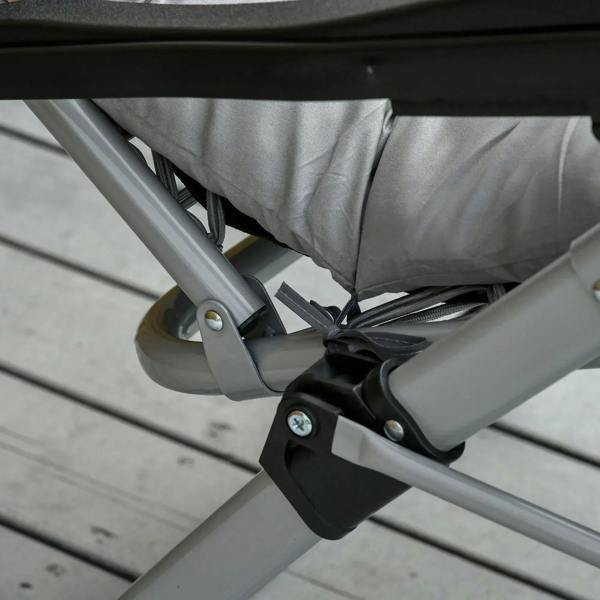 Light grey reclining lounge chair hinge and strap connection on metal base frame